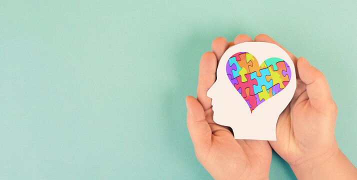 ASD autism spectrum disorder, deficits in social communication and interaction, mind with heart, colorful jigsaw or puzzle pieces 