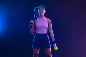 Tennis player woman with racket on tournament. Girl athlete with tenis racket on court with neon colors. Sport concept. Download a high quality photo for design of a sports app or tour events.