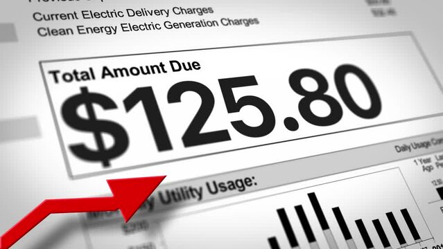 A close-up view of a household electric utility bill rising. Increasing cost of living concept.  	