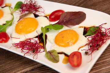 RECIPE FOR FRIED EGGS AND POMEGRANATE MOLASSES CUT INTO HEARTS, STARS AND FLOWERS. High quality photo