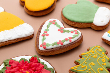 Christmas delicious gingerbread cookies on a brown background. Top view.