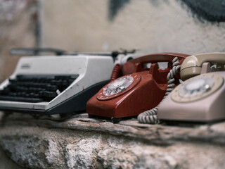 old telephones and an old typewriter