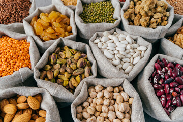 Various types of dried fruit and cereals at farmers market. Mung bean, almond, mulberry, garbanzo,...