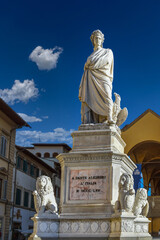 Naklejka premium Florence, Italy - December 07, 2023: Dante Alighieri Memorial, a large white marble statue of Dante Alighieri, erected in 1865 in Santa Croce Square.