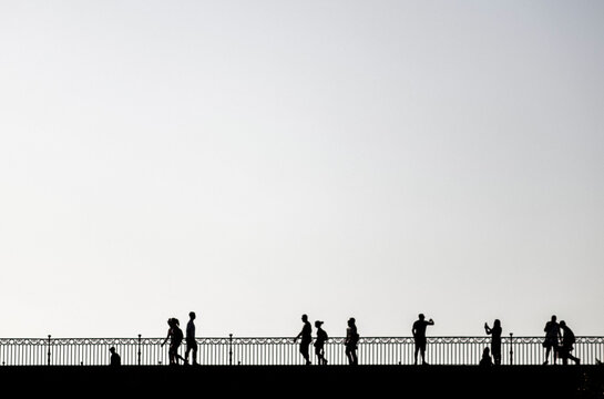 Silhouette of people on triana bridge, seville