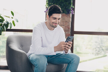 Photo of happy smiling young guy dressed white shirt chatting instagram twitter telegram facebook...