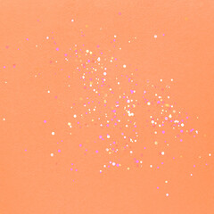 Peach fuzz color tinting. Colorful of confetti. Brilliant colored sequins. Holiday greeting card....
