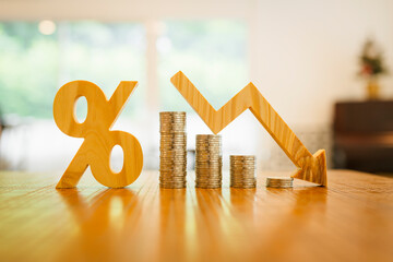 Percentage model, coin stack and down arrow, concepts for success, methods, systems of raising or lowering Fed interest rates to correct inflation concepts.