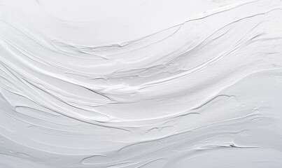 A smooth, swirling texture of silver paint with elegant waves and creamy details.
