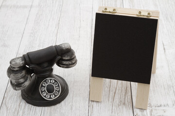Vintage retro rotary dial phone with chalkboard