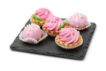 Group of mini cakes on slate plate