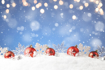 Christmas balls and snowflake with snow on color background