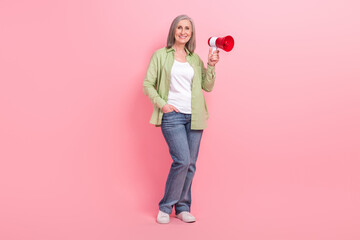 Full length photo of satisfied adorable woman wear stylish clothes hold bullhorn advertise special offer isolated on pink color background