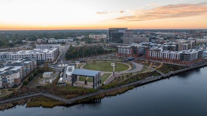Aerial view of the Riverfront Park in Wilmington, North Carolina during sunrise.
