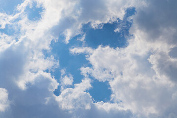Obraz premium Cumulus clouds in the blue sky close-up, among the clouds