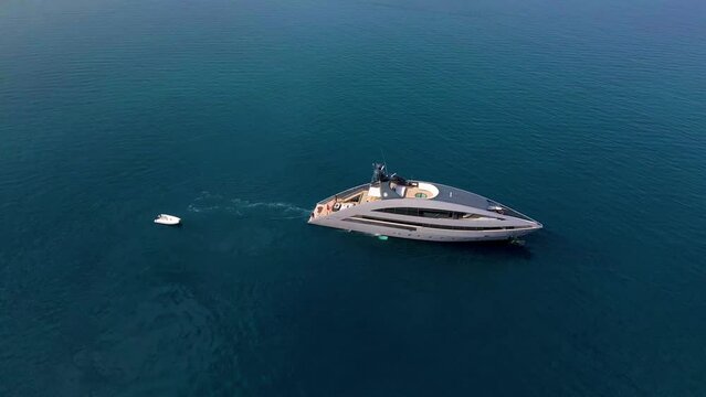 Aerial top view 4k footage by drone of luxury yacht in the sea.