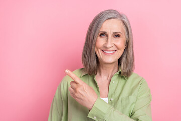 Photo of elderly business woman grey hair smiling direct finger indicate courses ad for old people...