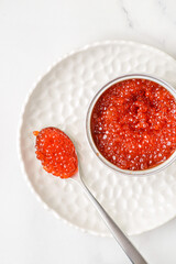 red caviar in a metal jar