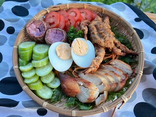 Crispy fried soft shell crab, baked chicken breast with boiled egg and vegetable salad