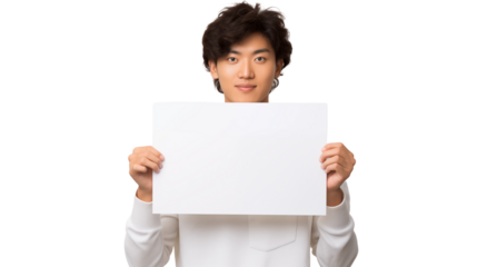 Young japanese man holding a white sign in front of him on a green background