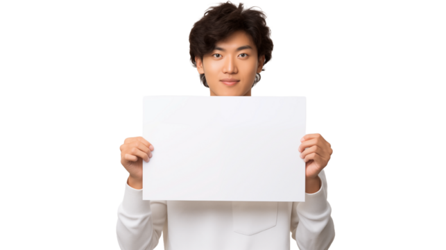 Young japanese man holding a white sign in front of him on a green background