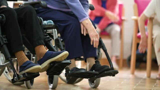 Seniors patients doing exercises in a retirement home. High quality 4k footage