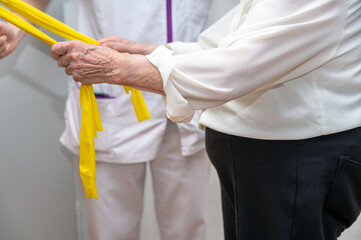 Seniors patients doing exercises in a retirement home. High quality photography.
