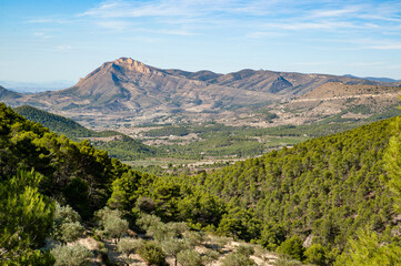 Panoramic view of the Peña de Jijona, traditionally known as the Peña Roja, at the foot of which is the municipality of Jijona, famous for the production of nougat.