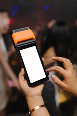 Order taking machine with touchscreen receipt printing on the background in the club bar.