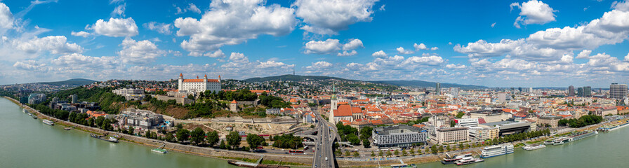 Naklejka na ściany i meble Extreme panoramic aerial view of Bratislava city center capital of Slovakia during hot summer day