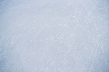 Ice with traces of skates, background.