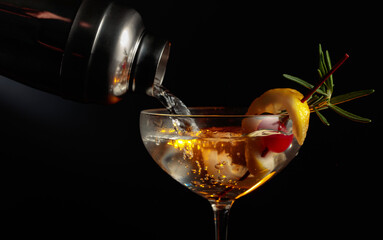 Martini with cherry, rosemary, and lemon.