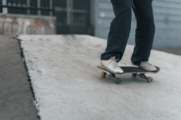 close up of the legs of a skater doing skate tricks