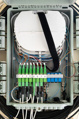 Fiber Optical cables connected to high-speed ports.  a hub box for connecting house cables to fast...