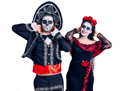 Young couple wearing mexican day of the dead costume over background relaxing and stretching, arms and hands behind head and neck smiling happy