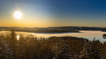 Stunning image of the sun setting over Lekomberget outside Ludvika city in Sweden