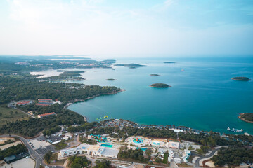 Spectacular aerial view of the sea coast in Croatia near the town of Porec with camping area. Shot from a drone.