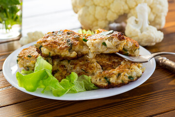 cooked vegetarian fried cauliflower cutlets in a plate