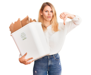 Young beautiful blonde woman holding recycle paper bin with angry face, negative sign showing dislike with thumbs down, rejection concept