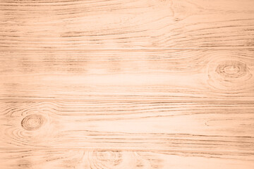 Background with color of the year -2024. Trendy color peach fuzz. Textured wooden background, burnt...