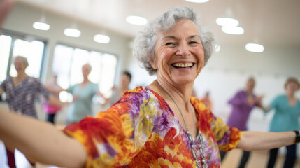 A woman in a colorful shirt is smiling and dancing.