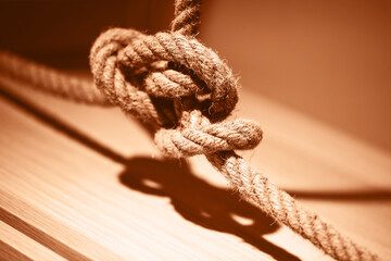 Blue rope tied up in a knot. Demonstrating color of the year 2024. - 689812186