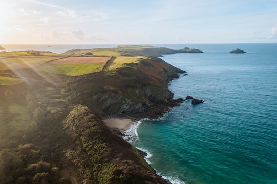 Aerial view of swimmer at secret cove, Talland Bay, Cornwall, United Kingdom.