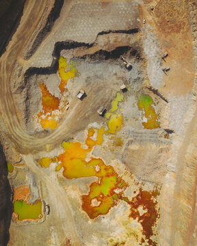 Aerial topdown shot of mine vehicles, in Minas de Rio Tinto, Andalusia, Spain.