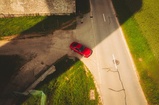 Aerial view of a Red Sport Japanese Car, Haute Vall&eacute;e de Chevreuse Park, Ile de France, France.