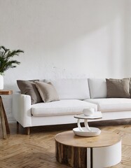 Fototapeta premium Round accent coffee table near white sofa against stucco wall. Scandinavian home interior design of modern living room in farmhouse