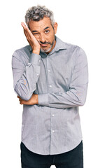 Middle age grey-haired man wearing casual clothes thinking looking tired and bored with depression...