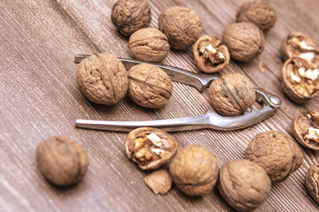 nutcracker next to walnuts. Cracking nuts before Christmas