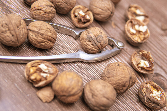 nutcracker next to walnuts. Cracking nuts before Christmas