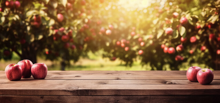 Empty rustic old wooden boards table copy space with apple trees orchard in background. Some ripe red fruits on desk. Product display template. Generative AI